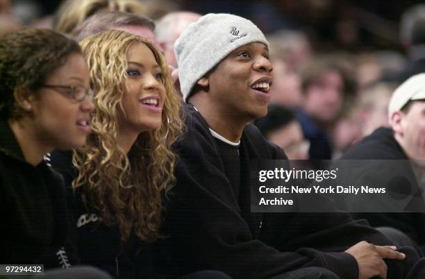 Singer-actress Beyonce Knowles of Destiny's Child and boyfriend rapper Jay-Z take in the action as the New York Knicks play the Orlando Magic at...