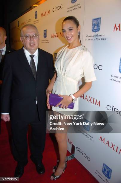 Gal Gadot, former Miss Israel 2004, and Israeli Ambassador Arye Mekel attend a Maxim magazine party at the club Marquee.