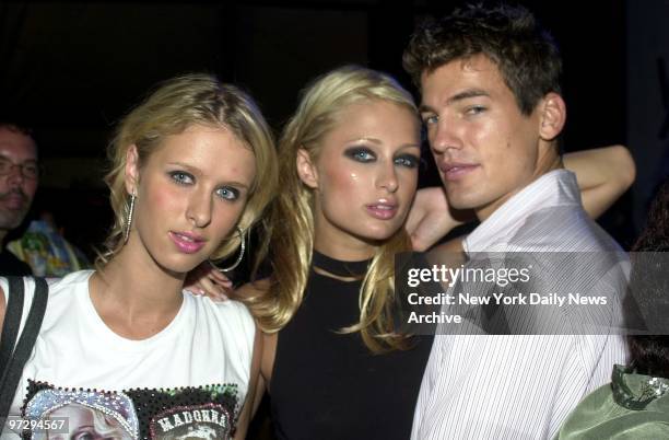 Sisters Nicky and Paris Hilton get together with a friend at a Vogue magazine party at the Capri Hotel's Cabana restaurant lounge in Southampton, L.I.