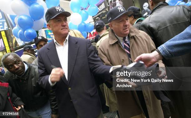 New York Yankees' great Craig Nettles hands out free Yankees' caps to fans at Father Duffy Square in Times Square as part of opening day celebration.