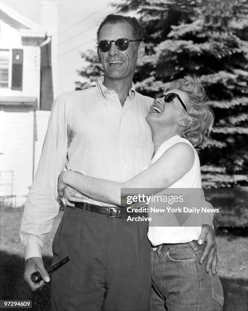 Marilyn Monroe and her fiance, Arthur Miller, on the lawn of Miller's home in Roxbury, Conn.