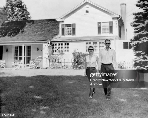 Marilyn Monroe and her fiance, Arthur Miller, on the lawn of Miller's home. ,