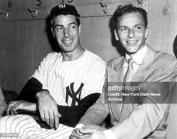 New York Yankees Hall-of-Famer Joe DiMaggio sits with Frank Sinatra at Yankee Stadium in 1949. DiMaggio died Monday, March 8 at his home in...