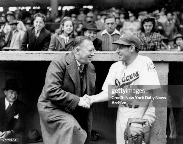 General Manager Larry MacPhail congratulates Leo Durocher on third-place finish.