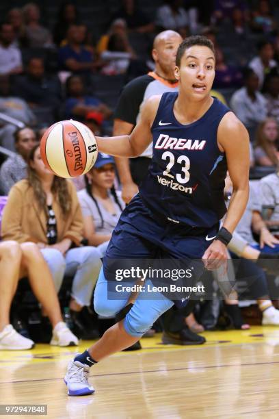 Layshia Clarendon of the Atlanta Dream handles the ball against the Los Angeles Sparks during a WNBA basketball game at Staples Center on June 12,...