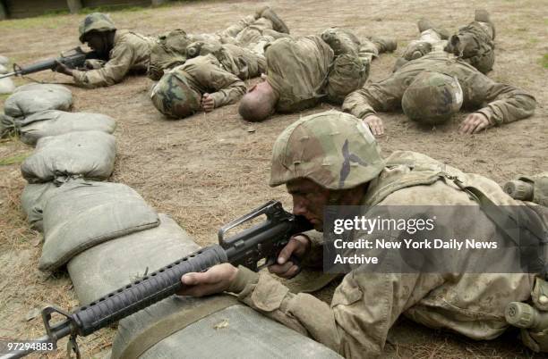 Marine recruits participate in an infiltration resupply source exercise as part of The Crucible, a 54-hour training exercise that they experience on...