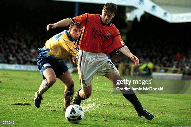 Damon Searle of Southend fends off Alex Inglethorpe of Canvey Island during the AXA FA Cup second round match between Canvey Island FC and Southend...