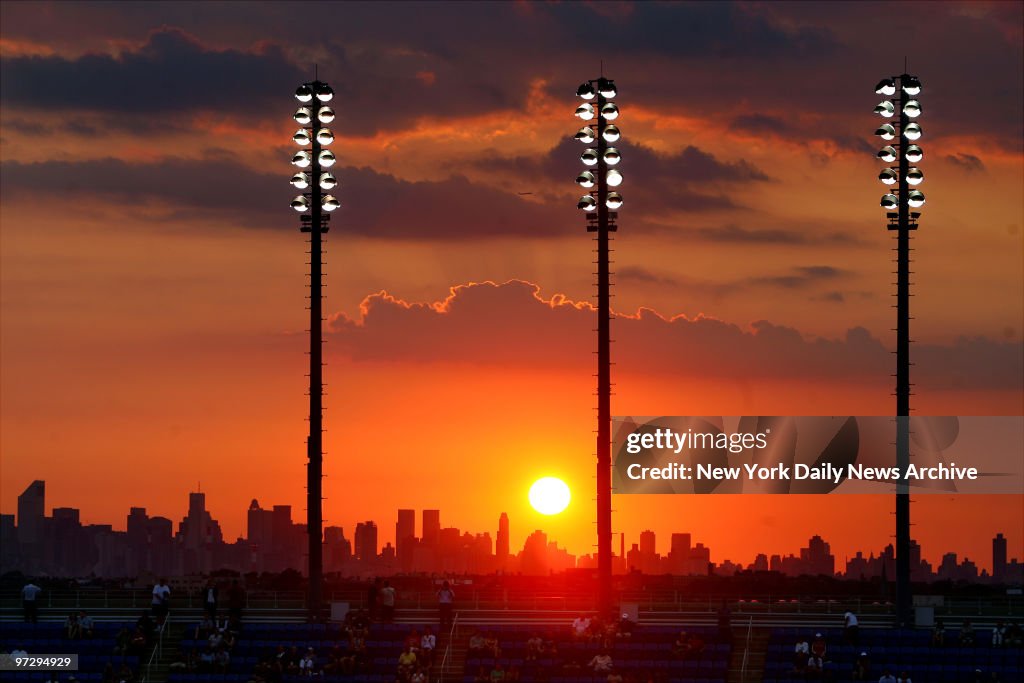 The sun sets over the skyline of Manhattan as seen from Arth