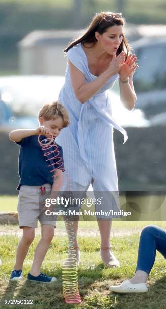 Prince George of Cambridge and Catherine, Duchess of Cambridge attend the Maserati Royal Charity Polo Trophy at the Beaufort Polo Club on June 10,...