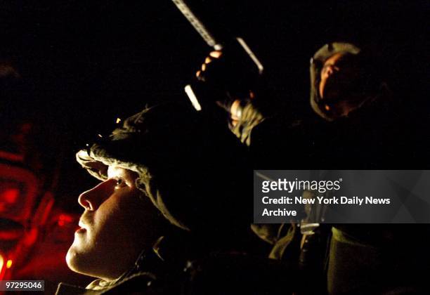 Marines from the Lima Company, 3rd Battalion, 8th Marines patrol the streets at night in Port-au-Prince, Haiti. The regiment, which is based in Camp...