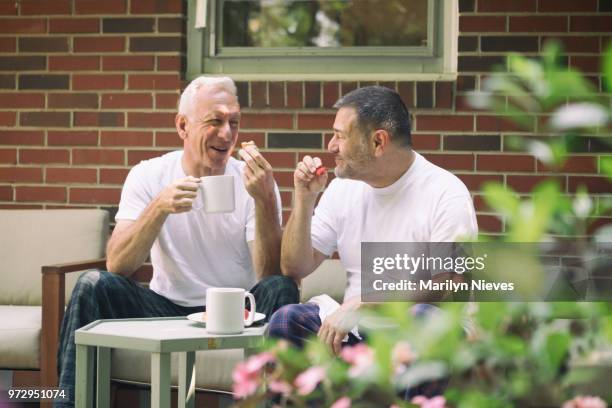 loving middle aged gay couple - marilyn nieves stock pictures, royalty-free photos & images