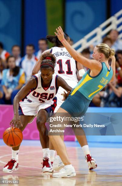 Sheryl Swoopes of the U.S. Dribbles the ball past Penny Taylor of Australia during the women's basketball final in the Olympic Indoor Hall at the...