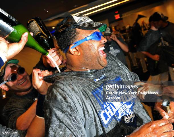 Sabathia is soaked by team mates as they celebrate in the club house after the Yankees defeated the Red Sox 4-2 winning the American League East.,