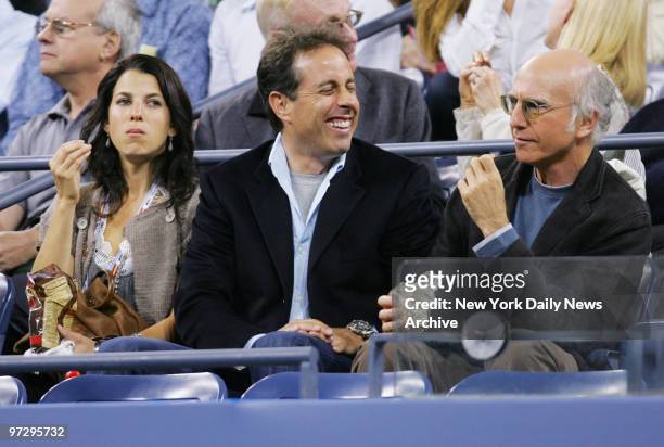 Jessica Seinfeld and husband Jerry are joined by Larry David at Arthur Ashe Stadium for a match between Jelena Jankovic of Serbia and Venus Williams...