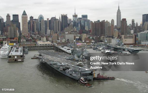 The USS John F. Kennedy docks at Pier 88 near the USS Intrepid on the Hudson River after its arrival in New York for the 18th Annual Fleet Week...