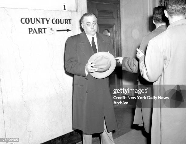 Frank Abbatemarco, alleged policy bank kingpin, outside courtroom after his bail was set...By William Price and Kermit Jaediker..A $2 000-a-year...