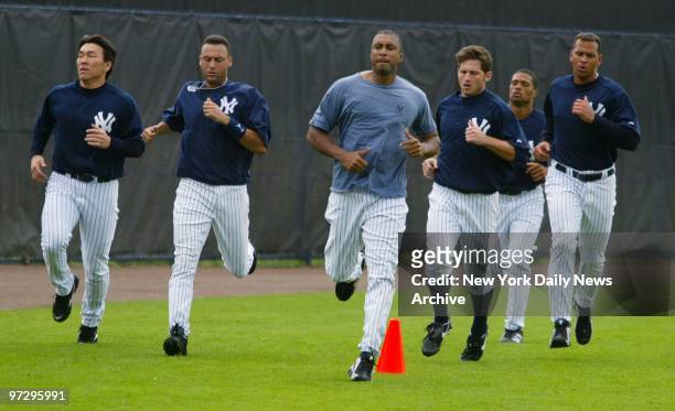 New York Yankees' Hideki Matsui, Derek Jeter, Bernie Williams, Bubba Crosby, an unidentified player and Alex Rodriguez jog at the end of a workout at...
