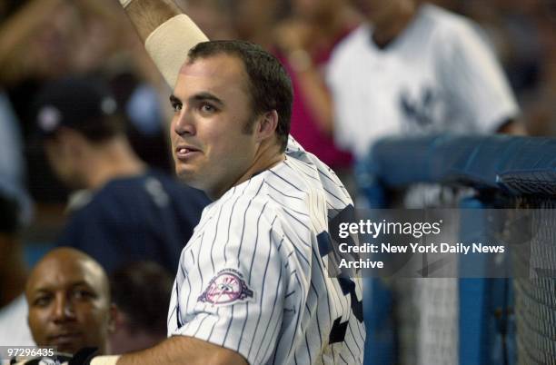 New York Yankees' infielder Nick Johnson takes a curtain call after hitting a grand slam in the sixth inning of game against the Seattle Mariners at...