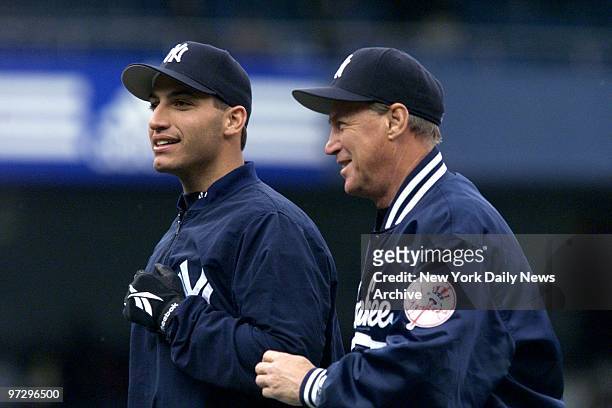 New York Yankees' injured pitcher Andy Pettitte with coach Mel Stottlemyre after the Yanks beat the Detroit Tigers 11-2 at Yankee Stadium.