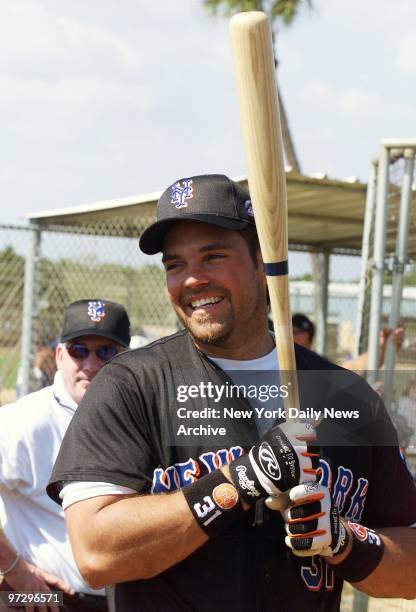 Catcher Mike Piazza is prepared to take his turn in the batting cage at the New York Mets' spring training camp in Port St. Lucie, Fla.