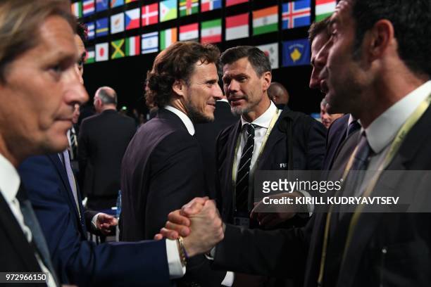 Miguel Salgado, Diego Forlan, FIFA Deputy Secretary General Zvonimir Boban and Luis Figo attend the 68th FIFA Congress at the Expocentre in Moscow on...