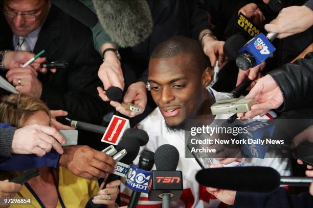 New York Giants' Plaxico Burress is interviewed during a media availability session at the team's hotel in Chandler, Ariz. The Giants will play the...