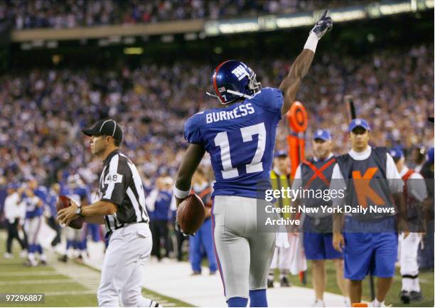 New York Giants' Plaxico Burress wide receiver Plaxico Burress celebrates after scoring a touchdown in the second period of a game against the...