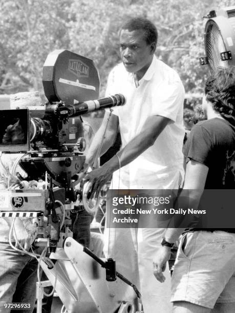 Sidney Poitier directing movie "Shoot-out" being filmed on Fifth Avenue.