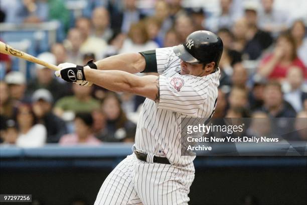 New York Yankees' Jason Giambi hits an RBI single in the first inning against the Tampa Bay Devil Rays at Yankee Stadium. The Yanks went on to win,...