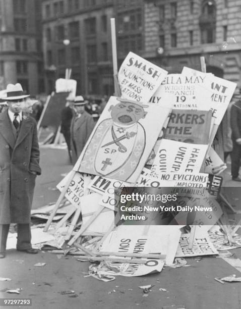 Signs are piled in the street after a May Day meeting in Union Square.