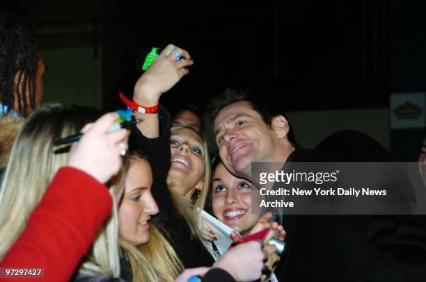 Jim Carrey has his picture taken with some adoring fans as he arrives for the 14th annual IFP Gotham Awards presentations at Pier 60, Chelsea Piers.