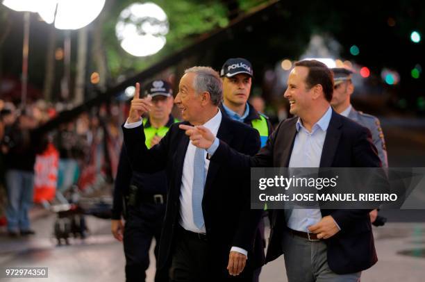 Portuguese President Marcelo Rebelo de Sousa and Lisbon Mayor Fernando Medina arrive to attend the Santo Antonio de Lisboa's Parade on Avenida da...