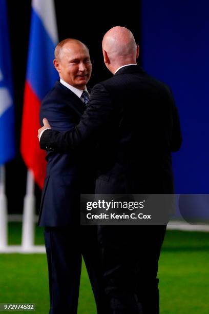 President of Russia, Vladimir Putin is greeted by FIFA President Gianni Infantino during the 68th FIFA Congress at the Moscow Expocentre on June 13,...