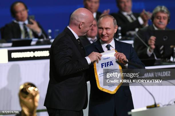 President Gianni Infantino Russian President Vladimir Putin attend the 68th FIFA Congress at the Expocentre in Moscow on June 13, 2018.