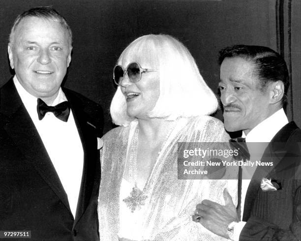 Frank Sinatra is bright-eyed and bushy-tailed backstage at Radio City Music Hall as he welcomes Peggy Lee and Sammy Davis Jr for Sinatra VII, Ol'...