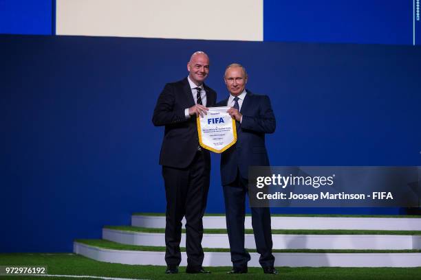 Vadimir Putin and Gianni Infantino pose during the 68th FIFA Congress at Expotsentr on June 13, 2018 in Moscow, Russia.