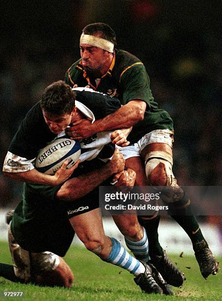Brian O''Driscoll of the Barbarians is stopped by Corne Krige of South Africa during the match between Barbarians and South Africa in the Scottish...