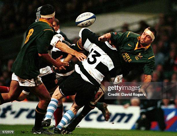 Corne Krige of South Africa is stopped by Brian O''Driscoll of the Barbarians during the match between Barbarians and South Africa in the Scottish...