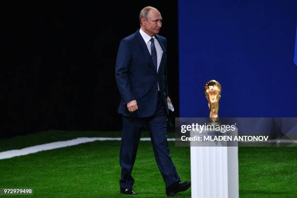 Russian President Vladimir Putin arrives to give a speech during the 68th FIFA Congress at the Expocentre in Moscow on June 13, 2018.