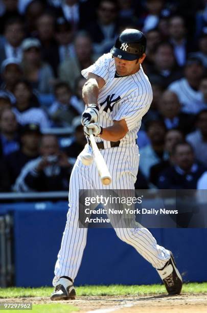 New York Yankees' Johnny Damon connects for a three-run home run in the fourth inning of Game 2 of the American League Division Series against the...