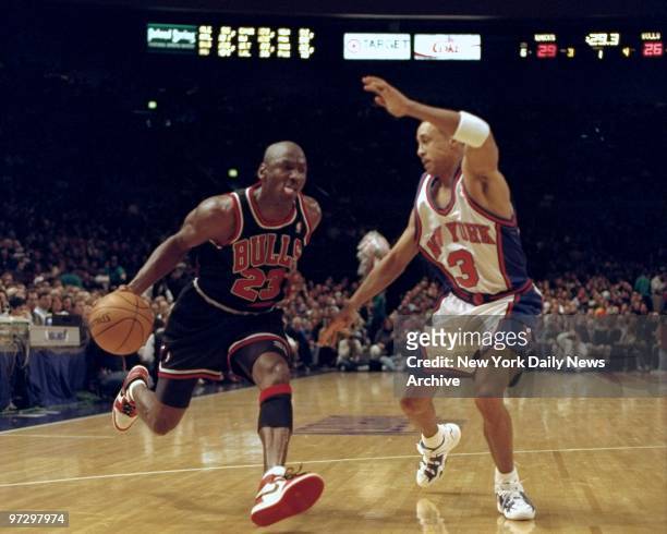 Chicago Bulls' Michael Jordan tries to get past New York Knicks John Starks.,