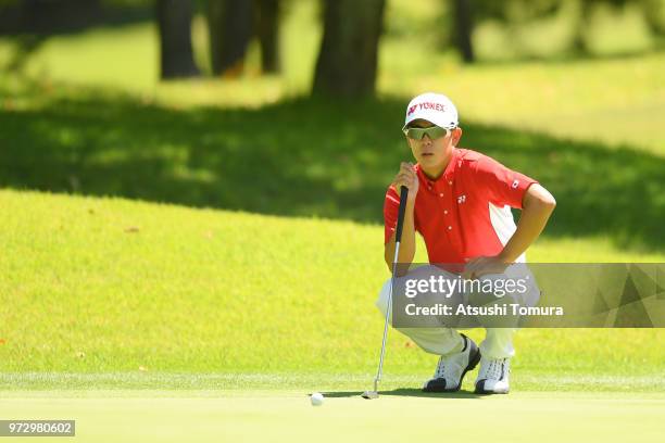 Keita Nakajima of Japan lines up his putt on the 16th hole during the second round of the Toyota Junior Golf World Cup at Chukyo Golf Club on June...