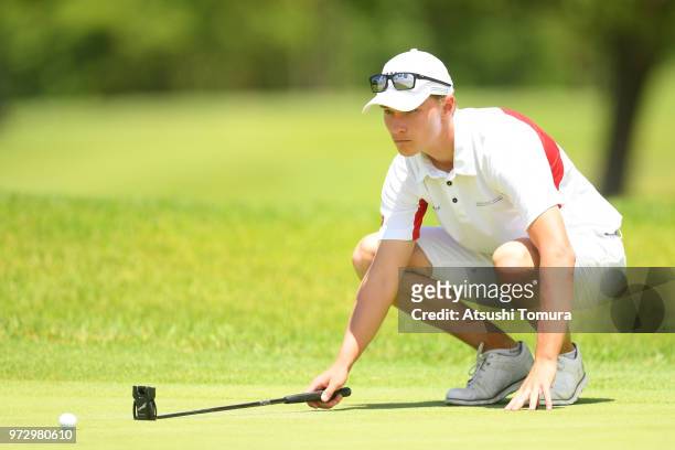 Rasmus Hojgaard of Denmark lines up his putt on the 8th hole during the second round of the Toyota Junior Golf World Cup at Chukyo Golf Club on June...