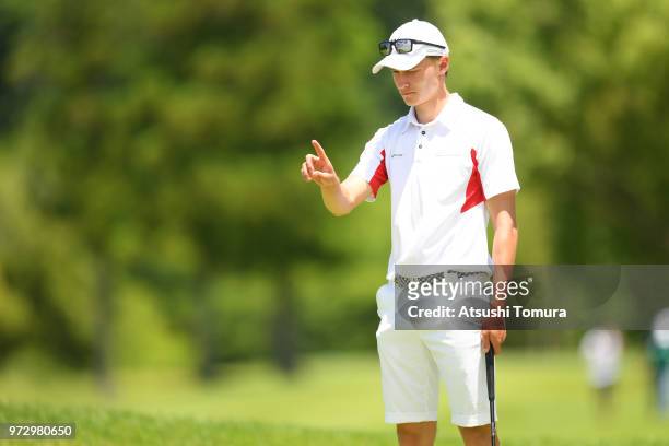 Rasmus Hojgaard of Denmark lines up his putt on the 8th hole during the second round of the Toyota Junior Golf World Cup at Chukyo Golf Club on June...