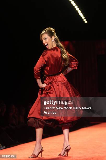 Singer and actress Thal?a struts the runway in a Vera Wang dress during the 2006 Heart Truth Red Dress Collection show at the Tent in Bryant Park on...