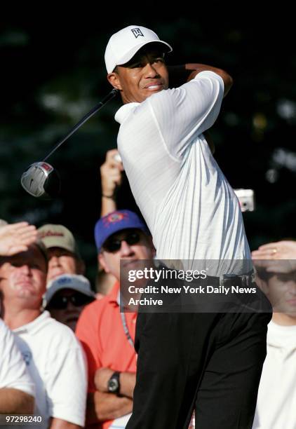 Tiger Woods tees off on the 18th hole during his practice round at the 87th PGA Championship at Baltusrol Golf Club in Spingfield, N.J.