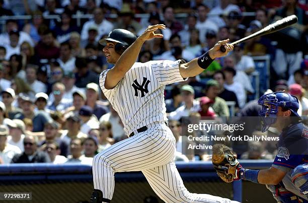 New York Yankees' Jorge Posada connects for a two-run homer in the fifth inning against the Toronto Blue Jays at Yankee Stadium. The Yanks belted...