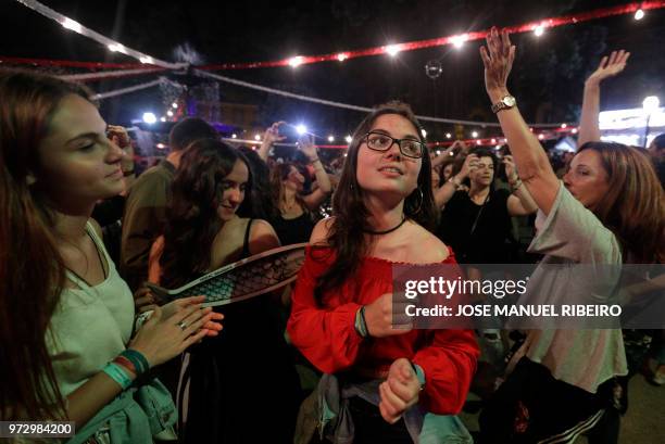 Revellers dance at the Praca da Alegria during the Santo Antonio de Lisboa's Parade on Avenida da Liberdade, in Lisbon on June 12, 2018. - Lisbon...