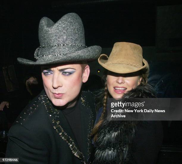 Singer Boy George and actress-model Carmen Electra are on hand for a party at a Boston nightspot.