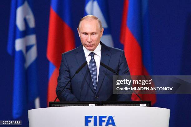 Russian President Vladimir Putin gives a speech during the 68th FIFA Congress at the Expocentre in Moscow on June 13, 2018.